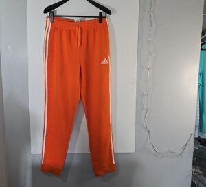 Adidas Orange Sweatpants with White Stripes